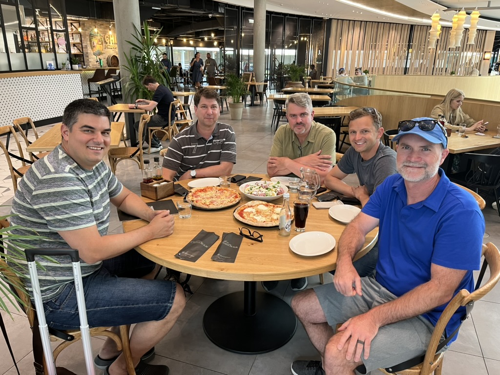 Five people sharing a meal during the Slovenia visit